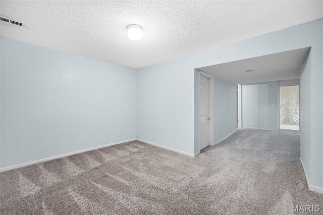 14 Sunderland Ct, Saint Charles, MO 63303 - spare room featuring carpet, baseboards, and a textured ceiling