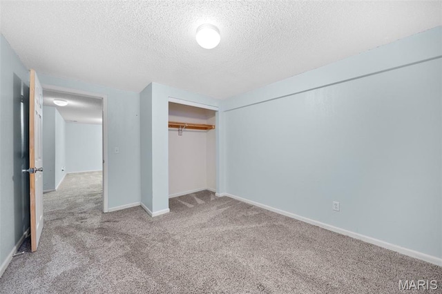 14 Sunderland Ct, Saint Charles, MO 63303 - unfurnished bedroom featuring carpet, a textured ceiling, a closet, and baseboards