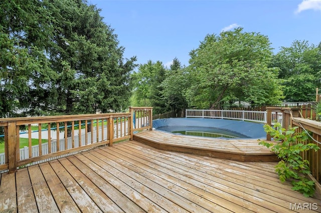 14 Sunderland Ct, Saint Charles, MO 63303 - wooden terrace featuring view of scattered trees