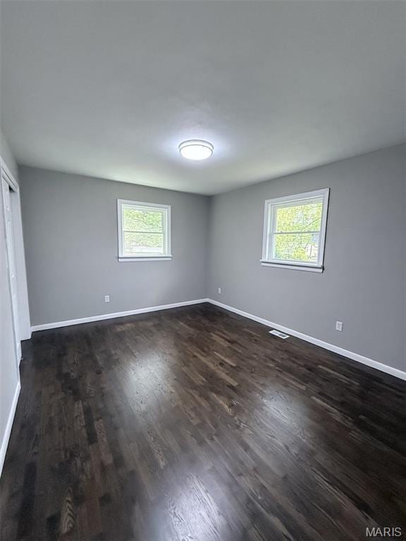 170 E Euclid Ave, Sullivan, MO 63080 - unfurnished bedroom with baseboards, dark wood-type flooring, and a closet