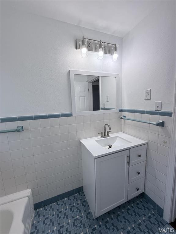 170 E Euclid Ave, Sullivan, MO 63080 - full bathroom with tile walls, tile patterned floors, wainscoting, vanity, and a bath