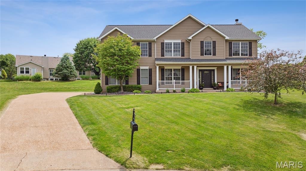 7464 Timberwolf Trl, Fairview Heights, IL 62208 - view of front facade featuring a porch and a front yard