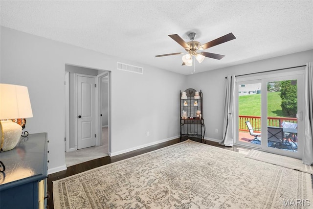 207 Straightoak, Ballwin, MO 63021 - empty room with a ceiling fan, dark wood-style flooring, a textured ceiling, and baseboards