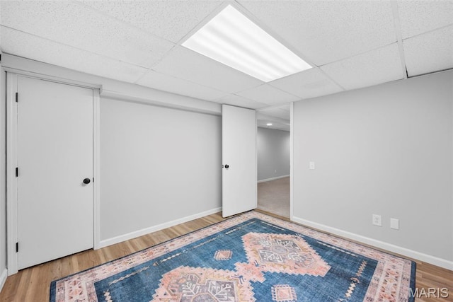 207 Straightoak, Ballwin, MO 63021 - finished below grade area featuring wood finished floors, a drop ceiling, and baseboards