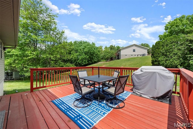 207 Straightoak, Ballwin, MO 63021 - wooden terrace with outdoor dining space, a lawn, and view of wooded area