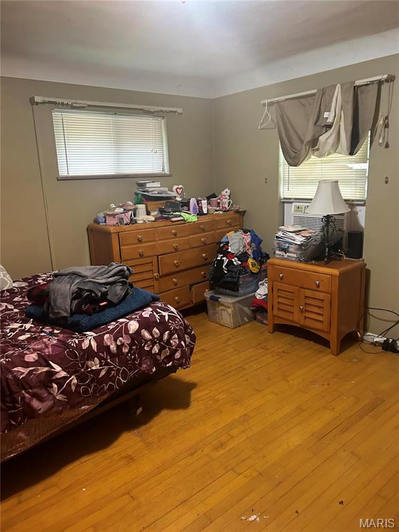 bedroom featuring wood finished floors