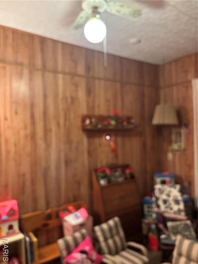 919 S 5th St, Greenville, IL 62246 - living room with wooden walls and ceiling fan