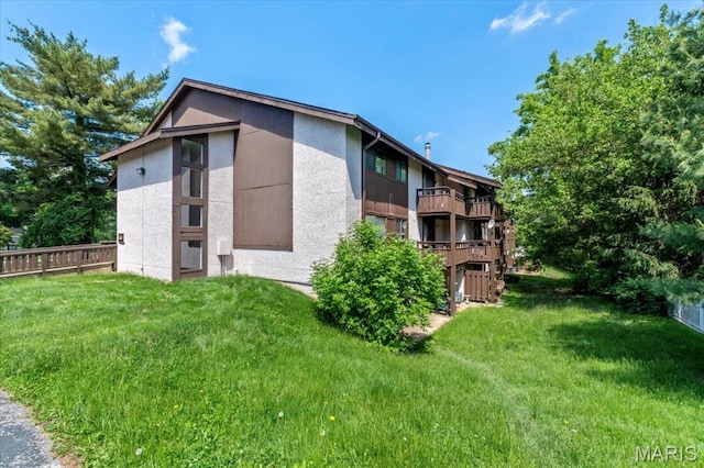 view of property exterior with a balcony