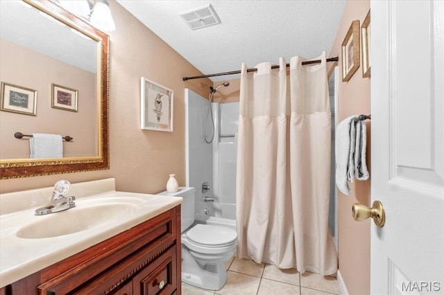 bathroom featuring tile patterned floors, vanity, toilet, shower / bath combination with curtain, and a textured ceiling