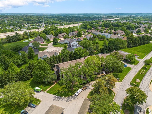 aerial view of property's location with nearby suburban area