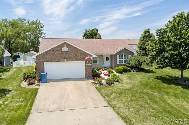 ranch-style house featuring brick siding, driveway, a garage, and a front lawn