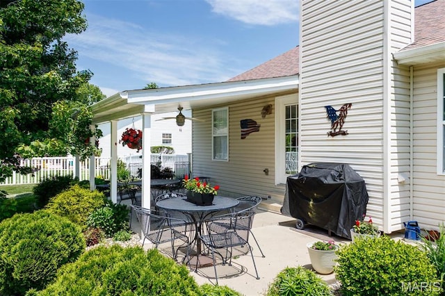 view of patio / terrace with area for grilling and fence