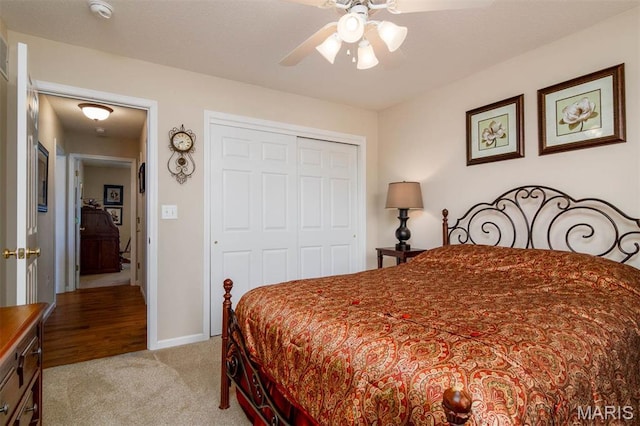 bedroom with carpet flooring, a closet, and a ceiling fan