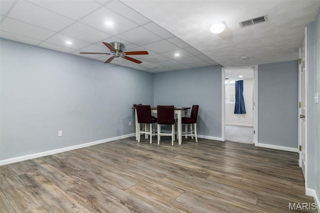 dining room with wood finished floors, ceiling fan, baseboards, and recessed lighting
