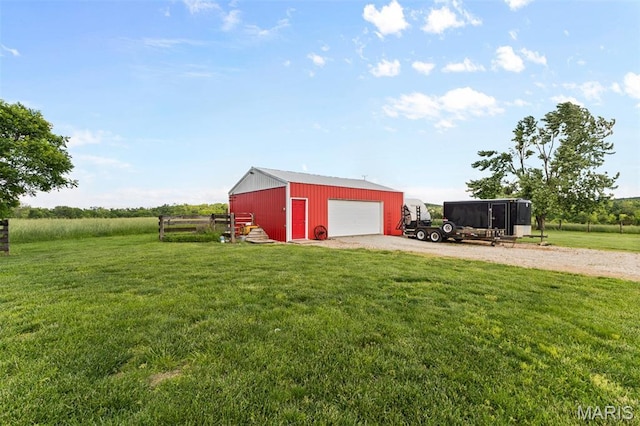 5704 Feezor Rd, Farmington, MO 63640 - view of green lawn featuring gravel driveway, an outbuilding, and a garage