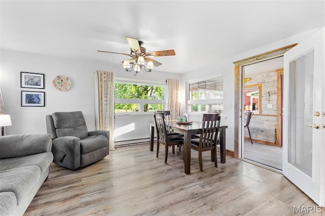 5704 Feezor Rd, Farmington, MO 63640 - dining room with light wood-type flooring, a baseboard heating unit, and ceiling fan