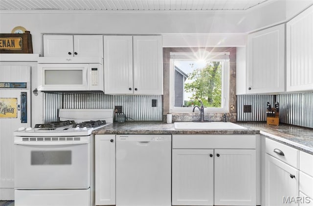 5704 Feezor Rd, Farmington, MO 63640 - kitchen featuring white appliances, a sink, and white cabinets