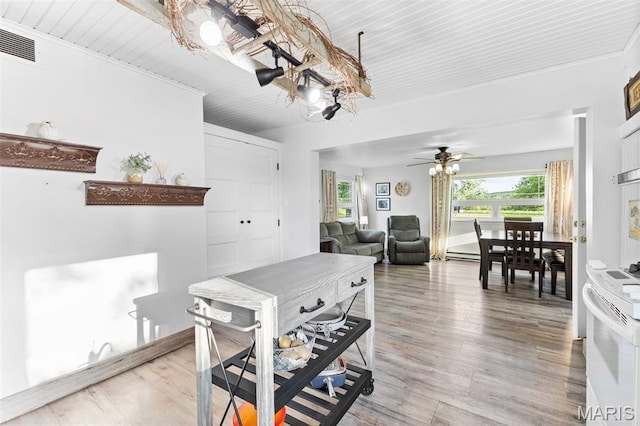 5704 Feezor Rd, Farmington, MO 63640 - dining room with light wood-style flooring, ceiling fan, and a chandelier