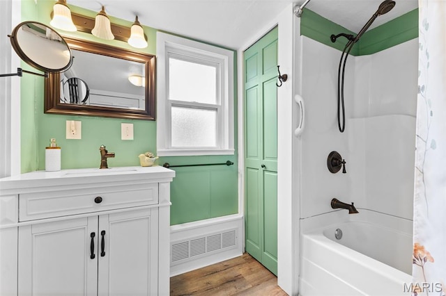 5704 Feezor Rd, Farmington, MO 63640 - full bath featuring shower / bath combination with curtain, vanity, and wood finished floors