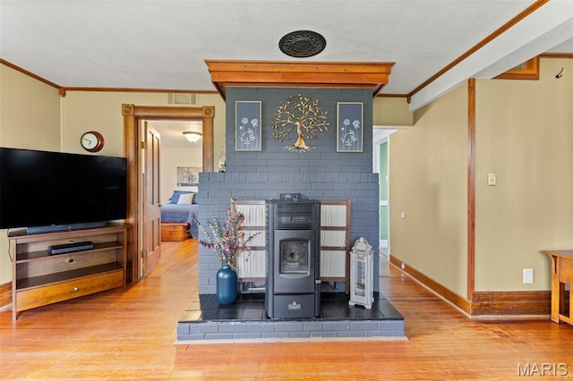 5704 Feezor Rd, Farmington, MO 63640 - detailed view of ornamental molding, wood finished floors, a fireplace, and baseboards