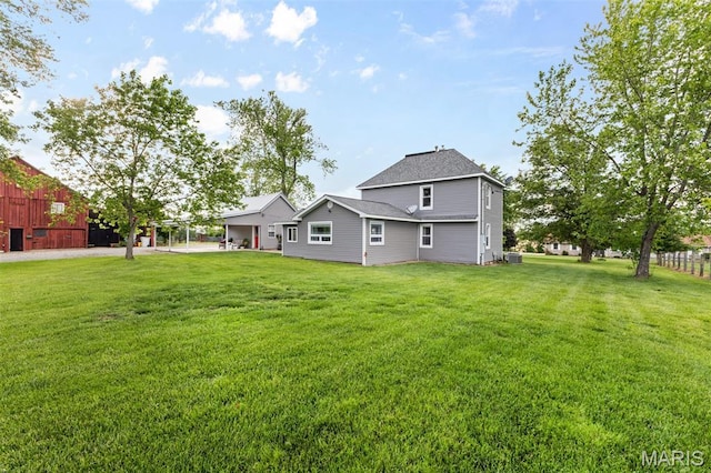 5704 Feezor Rd, Farmington, MO 63640 - rear view of house featuring a yard and central AC