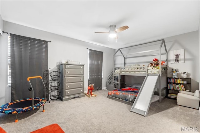 carpeted bedroom featuring a ceiling fan