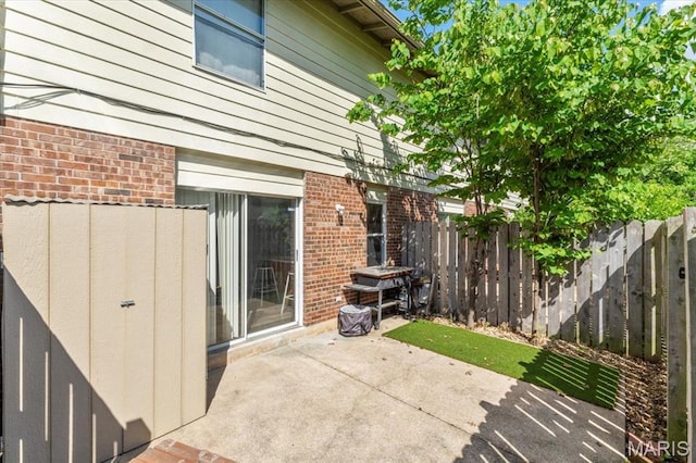 view of patio featuring fence