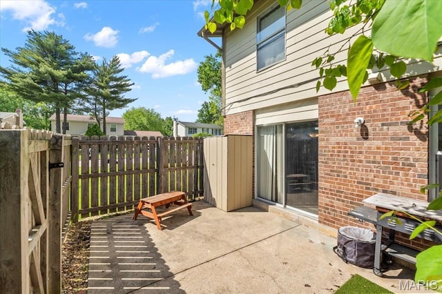 view of patio featuring fence