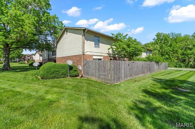 view of home's exterior featuring brick siding