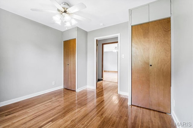 1522 S Elm Ave, Saint Louis, MO 63119 - unfurnished bedroom featuring wood finished floors, baseboards, and ceiling fan
