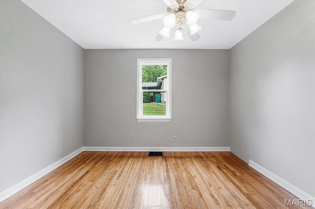 1522 S Elm Ave, Saint Louis, MO 63119 - empty room featuring light wood-style flooring, baseboards, and ceiling fan