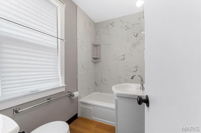 1522 S Elm Ave, Saint Louis, MO 63119 - full bath with toilet, wood finished floors, shower / tub combination, and a sink