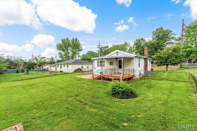 1522 S Elm Ave, Saint Louis, MO 63119 - rear view of property with a wooden deck and a chimney