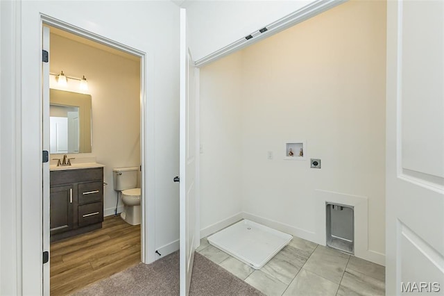 clothes washing area with electric dryer hookup and hookup for a washing machine