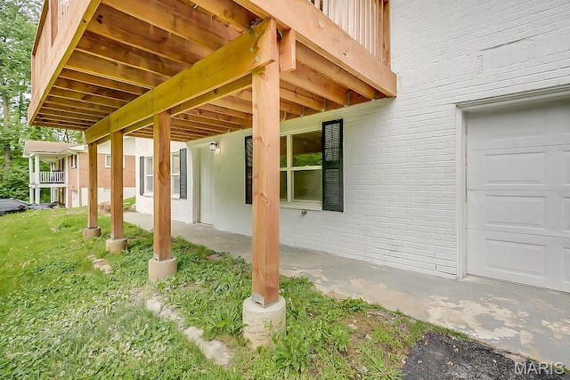 view of patio / terrace featuring a garage