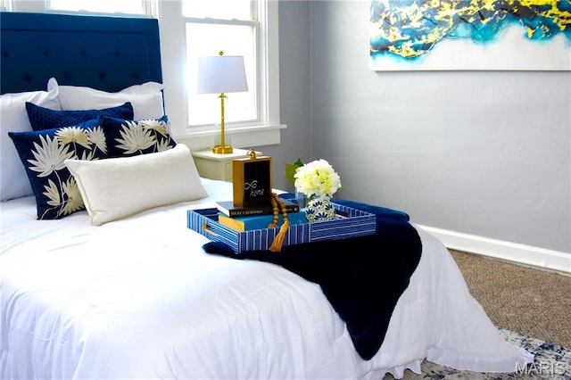 carpeted bedroom with baseboards