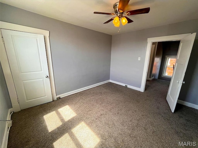 unfurnished bedroom with carpet, baseboards, and ceiling fan
