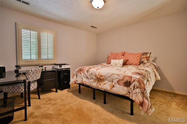 1989 Dogwood Trl, Collinsville, IL 62234 - bedroom featuring a textured ceiling, light colored carpet, and a desk