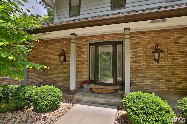 1989 Dogwood Trl, Collinsville, IL 62234 - view of exterior entry with covered porch and brick siding
