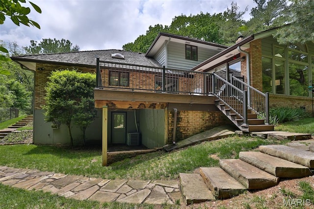 1989 Dogwood Trl, Collinsville, IL 62234 - rear view of house with stairs, brick siding, a wooden deck, central AC, and a sunroom
