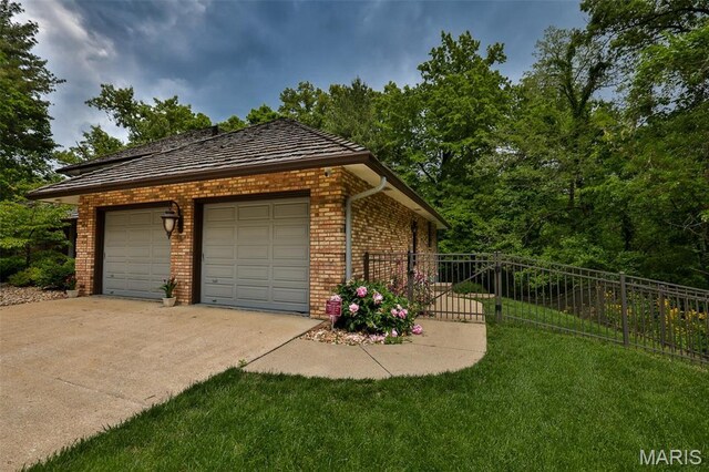 1989 Dogwood Trl, Collinsville, IL 62234 - view of home's exterior with brick siding and a garage
