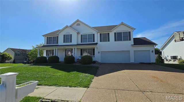 traditional-style home featuring a front yard, an attached garage, covered porch, and concrete driveway