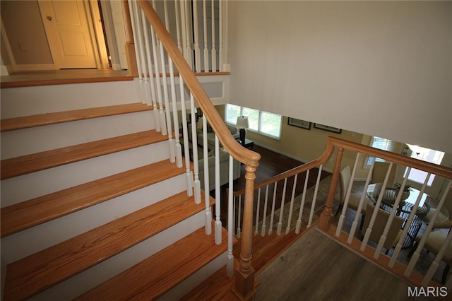 stairs with wood finished floors