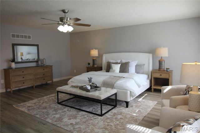 bedroom featuring wood finished floors, baseboards, and ceiling fan