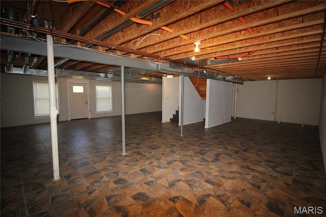 below grade area featuring dark stone finish flooring
