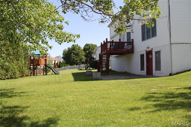 view of yard featuring stairway and a deck