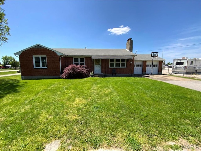 401 Edinger Rd, Wentzville, MO 63385 - ranch-style house featuring brick siding, a chimney, a front lawn, a garage, and concrete driveway