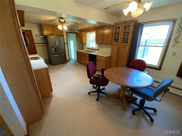 401 Edinger Rd, Wentzville, MO 63385 - dining space with a ceiling fan, light carpet, and baseboard heating