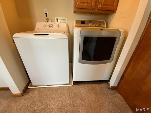 401 Edinger Rd, Wentzville, MO 63385 - laundry area with separate washer and dryer, carpet flooring, baseboards, and cabinet space