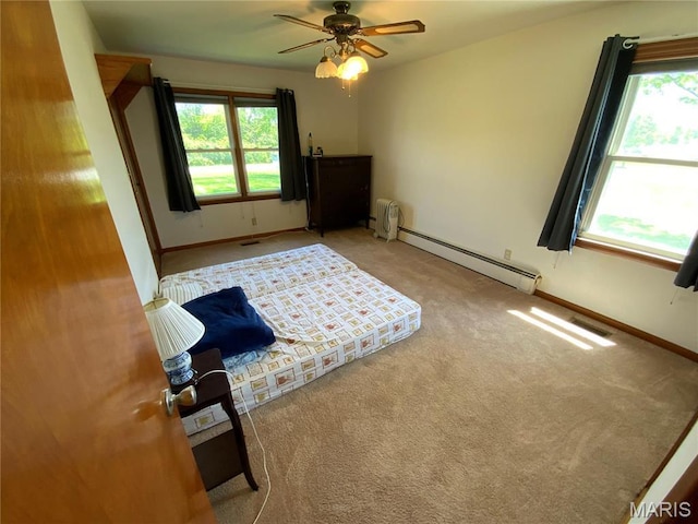 401 Edinger Rd, Wentzville, MO 63385 - bedroom with a baseboard radiator, carpet, baseboards, and a ceiling fan